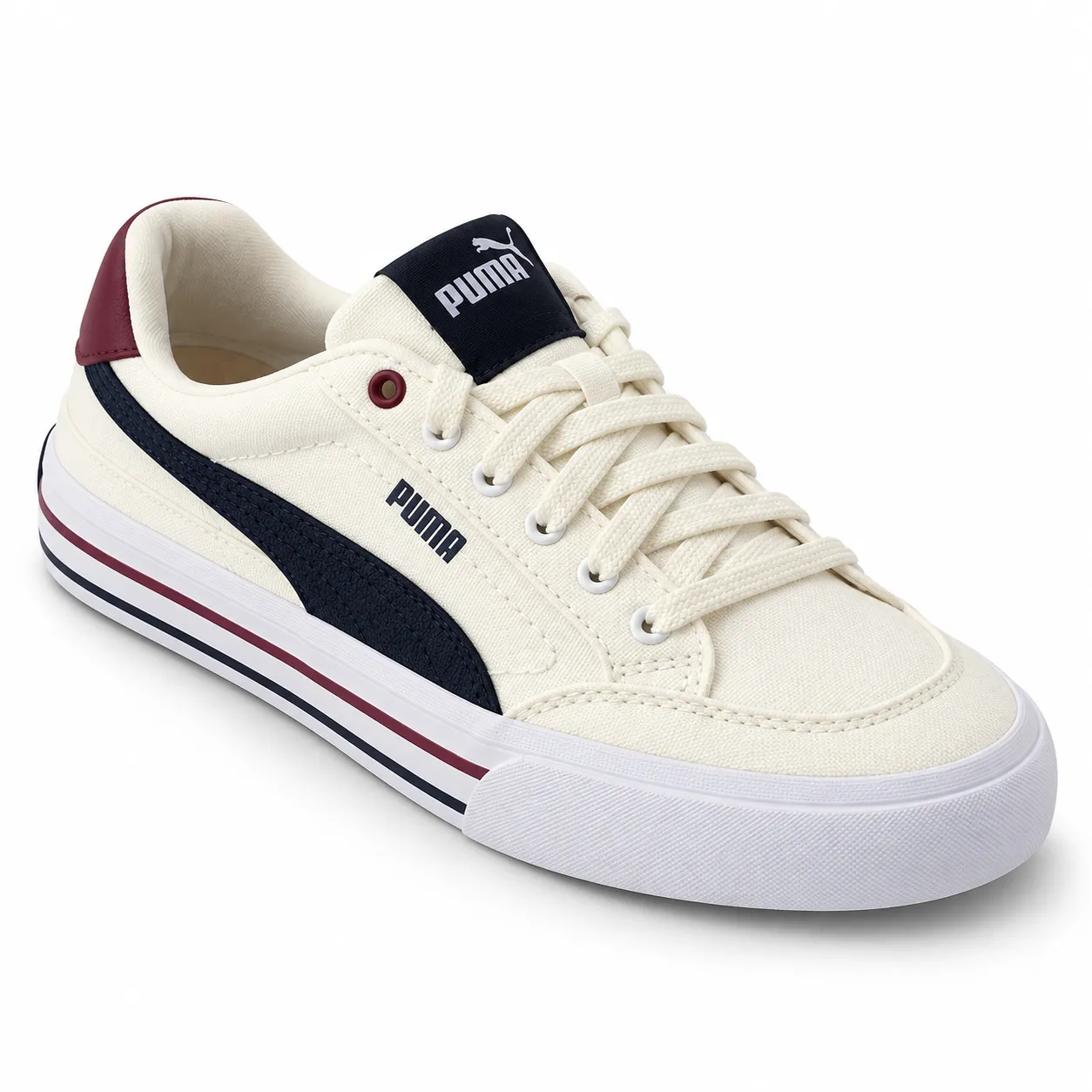 A cream Puma sneaker photographed from a three-quarter angle on a seamless white background