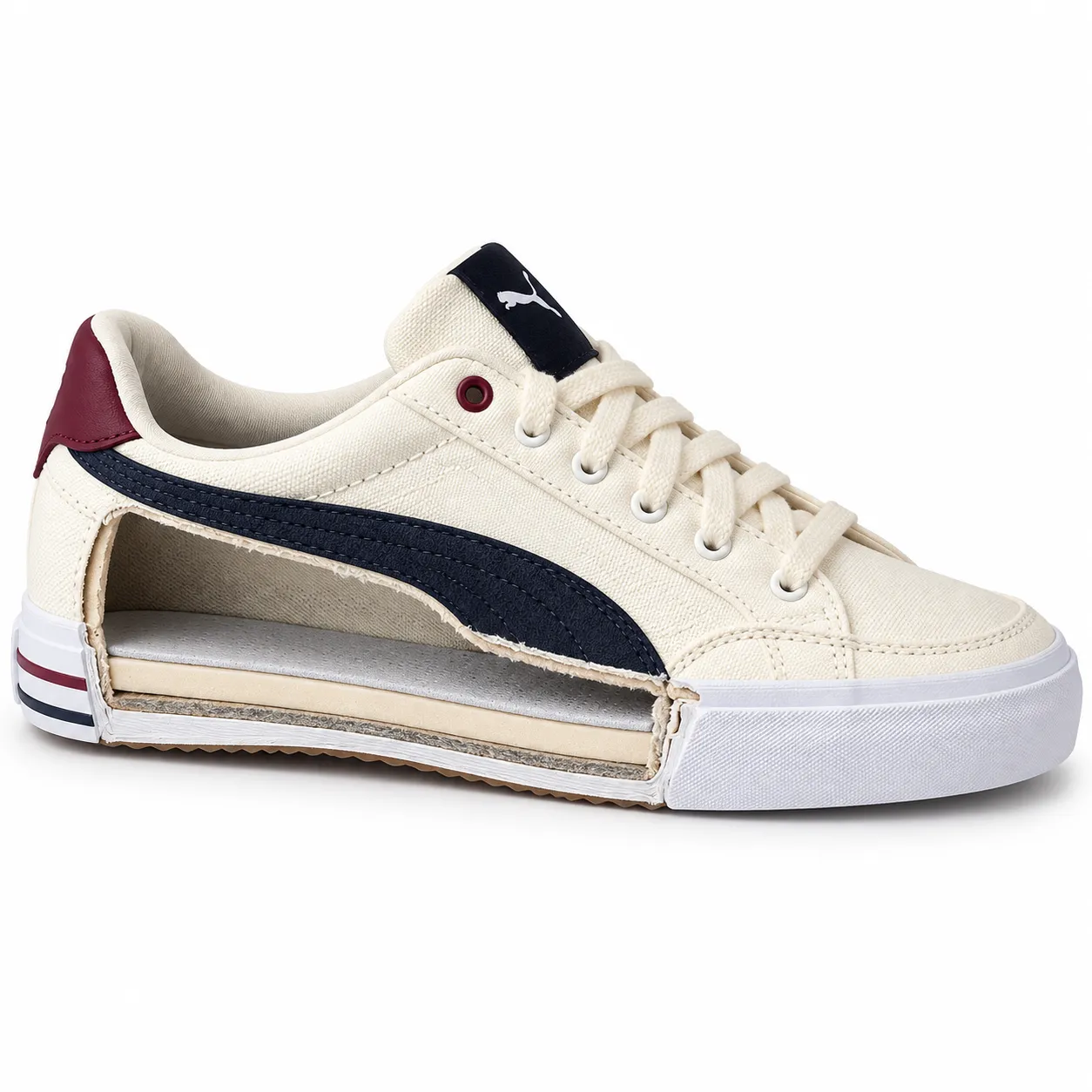 A cutaway cross-section view of a cream Puma sneaker revealing the midsole cushioning layer