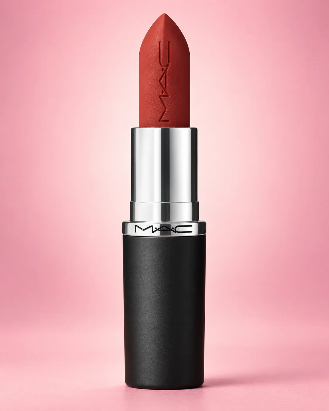 Lipstick tube standing upright against a soft pink gradient background, even studio lighting from a ring light, straight-on angle, shot on a 100mm macro lens at f/8, playful modern mood, soft pastel color grade, commercial product photography, 4:5.